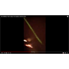 Screenshot: 6:41 in the YT Video "The Horrible Truth About the Northern California Fires" - Has momentary night helicopter footage of a laser beam against a background of burning residential premises