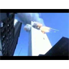 Video: South Tower Impact From Street Level - Has footage from Evan Fairbanks' video shot at the WTC on the morning of the attacks, the "Woolworth's Missile" becomes visible at 05 seconds