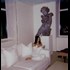 Kim Kardashian just posted a picture of herself eating pizza in front of a statue of a giant baby.